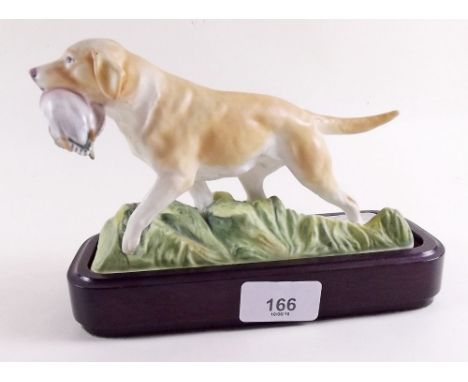 A Royal Worcester yellow labrador by Doris Lindner 