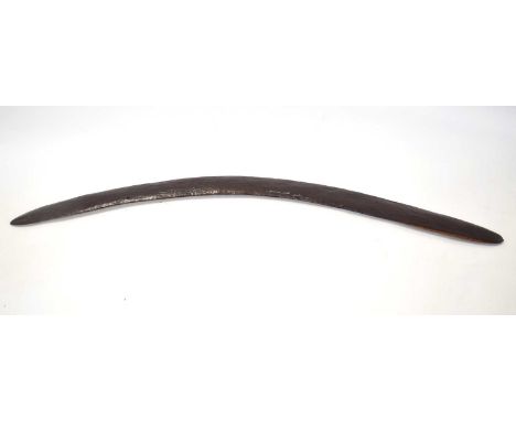 19th Century Aboriginal wooden carved Boomerang approx. 78cm long with three drilled holes along the body.