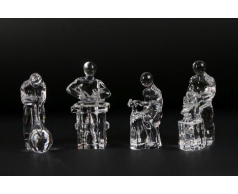 Four Orrefors Swedish glass paperweights in the form of craftsmen, to include glassblower, blacksmith, cobbler &amp; carpente