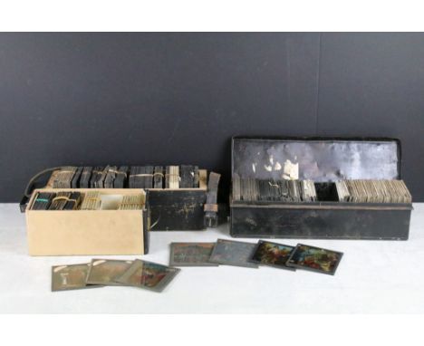 A collection of approx 100 x glass magic lantern slides contained within three wooden cases to include religious, the pleasur