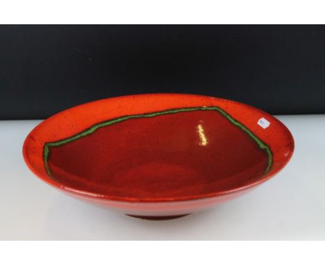 Large Poole pottery red and glazed centrepiece bowl. Signed to verso. Measures approx 36cm diameter. 