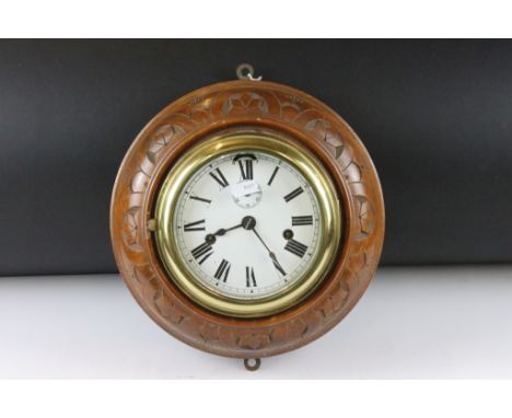Carved wood &amp; brass nautical ships clock, the white enamel dial with Roman numerals, poker style hands, subsidiary second