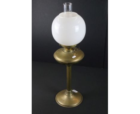 19th Century Victorian brass oil lamp having a reeded column base with white glass orb shade. Measures 69cm tall. 