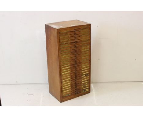 Early 20th century oak magic lantern slide cabinet with 56 drawers, each drawer generally with 12 spaces for slides, the cabi