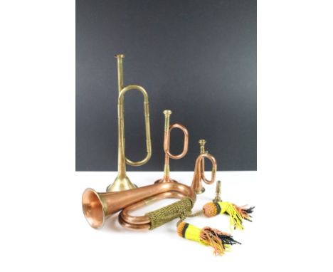 Copper &amp; brass bugle with braided tassels, together with a brass trumpet (37cm long), and two smaller copper &amp; brass 