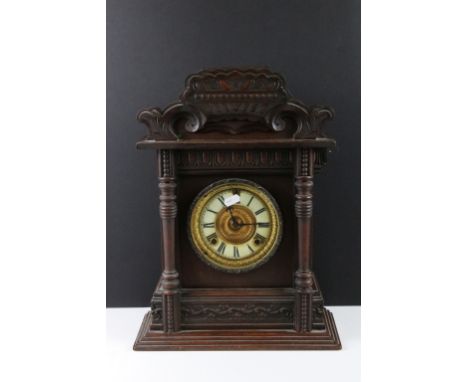 Early 20th century carved wooden chiming mantle clock, with cream dial, Roman numerals &amp; Ansonia Clock Co movement, appro