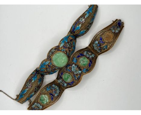 *****RE-OFFER £150 - £250*******&nbsp;

A pair of silver gilt enameled Bracelets each set with jade panels and with blue and 