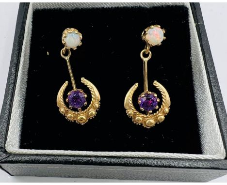 A pair of Amethyst and opal 9ct gold drop earrings with post fittings.&nbsp; Hallmarked for Birmingham 1987. Drop approx 2.12