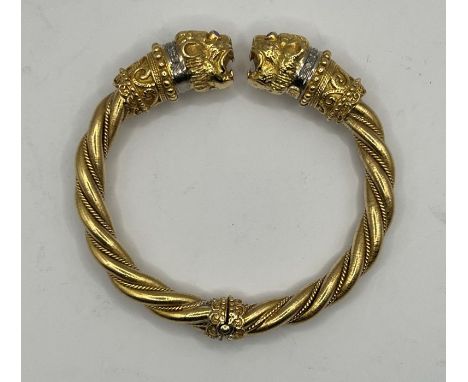 *****RE-OFFER £2000 - £2500*******&nbsp;

A LALAoUNIS double lion head torc in 18 carat gold, with ruby eyes (four total), pl