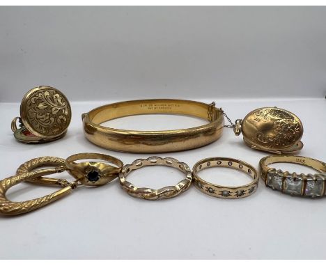 A 9ct rolled gold bangle, engraved; a pair of 9ct gold earrings,;yellow metal oval locket, bale stamped for 9ct (2.7 grams); 