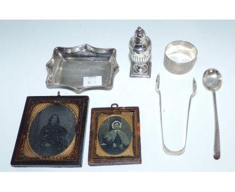 An engraved silver pin tray, a silver pin tray, a silver pepper pot, napkin ring , sugar tongs and preserve spoon 13.7g&nbsp;