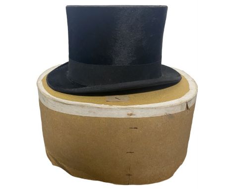 An early 20th century top hat made by Linney, London, flannel dress waistcoat and handkerchief box (3)some wear around the ed