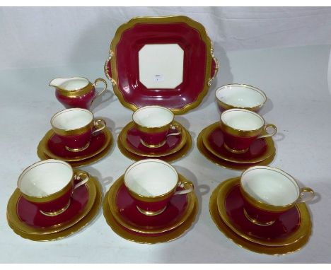 An Aynsley tea service for six to include cream jug, sugar basin with claret band and tooled gilt border, printed markscondit