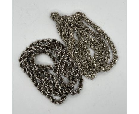 A pair of white metal chains, one a rope chain, measuring approximately 80 cms, stamped "Sterling silver" on the spring ring 