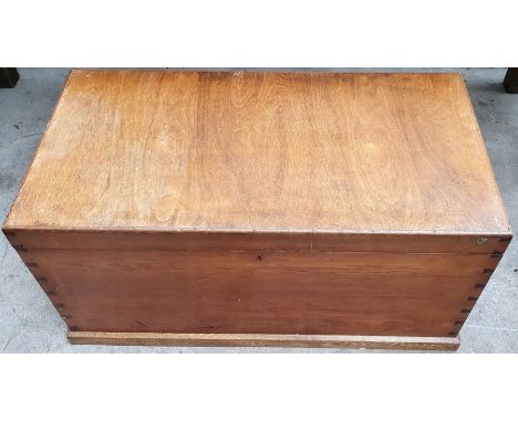 A 20th century oak and pine travel trunk, rectangular form with a caddy lid to reveal storage space. metal locks and swan nec