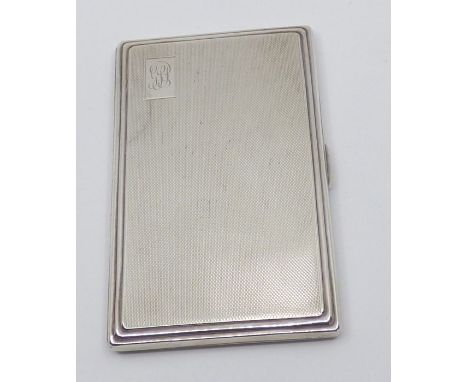 Silver engine turned cigarette case , hallmarked Birminghan 1946 . engraved initials in top right corner .Total weight 227 gr