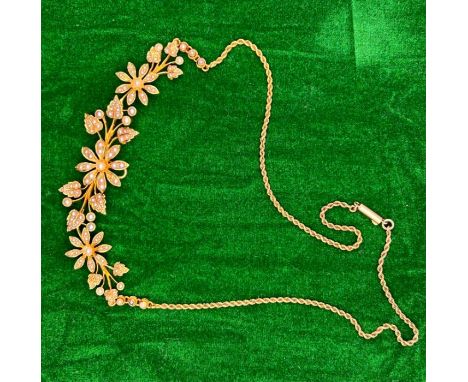 A fine Victorian yellow metal and seed pearl floral necklace. Stamped 15ct to the clasp. Tested - tests in the range for 15 c