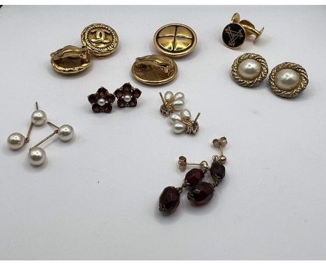 Two pairs of Chanel gilt earrings, with clip fastenings, two pairs of cultutred pearl earrings, a pair of 9ct garnet and pear