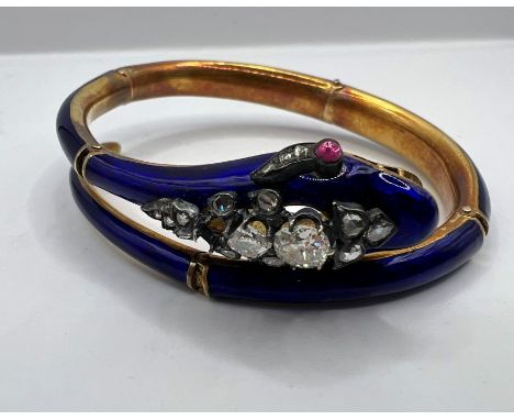 A fine guilloche enamel Victorian serpent bangle, in a fitted case from TR Sachs, Practical Jeweller to the Queen & Royal Fam