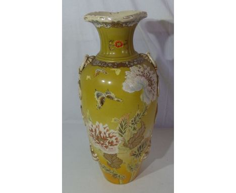 Large Japanese vase , decorated with flowers and butterflies on a mustard body , 47cm high