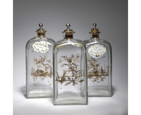 THREE BOHEMIAN GLASS DECANTERS19TH CENTURYof rectangular form, gilded with scenes including: a boar hunt, a shepherdess and o
