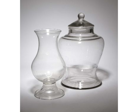 A GLASS STORAGE JAR AND COVER19TH CENTURYof inverted baluster form, with a ball finial, together with a baluster shaped vase,