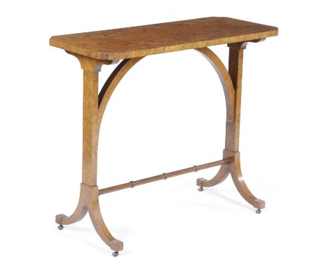 A KARELIAN BURR BIRCH OCCASIONAL TABLE19TH CENTURYthe rectangular top with cusped corners, with an arched support and a ring 