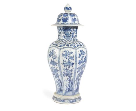 A CHINESE PORCELAIN BLUE AND WHITE VASEKANGXI (1662-1722)of octagonal, inverted baluster form, painted with panels of floweri