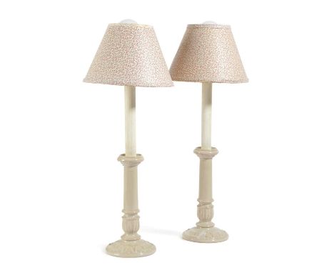 A PAIR OF CERAMIC CANDLESTICK TABLE LAMPS20TH CENTURYeach with a tapering stem above a stiff leaf base and foot, with Colefax