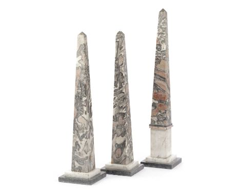 A GARNITURE OF ITALIAN MARBLE GRAND TOUR OBELISKSMID-19TH CENTURYthe pink and grey marble obelisks on carrara and black marbl