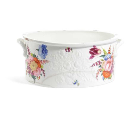 AN ENGLISH PORCELAIN FOOTBATH19TH CENTURYof oval form, moulded with flowers and painted with bright floral arrangements, repa