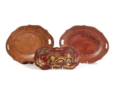 TWO PAPIER-MÂCHÉ TRAYSIN REGENCY STYLE, LATE 19TH / EARLY 20TH CENTURYof shaped oval form with pierced handles and gilt decor