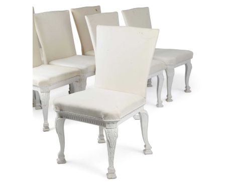 A SET OF EIGHT WHITE PAINTED DINING CHAIRSAFTER A DESIGN BY WILLIAM KENT, 19TH / 20TH CENTURYeach with a padded back and seat