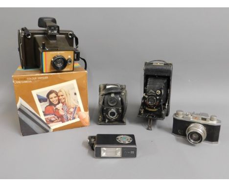 A small selection of vintage cameras: Polaroid Colour Swinger Land Camera, Voightlander Bessa, Ensign, Vivitar 151 &amp; Hali