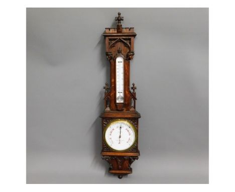 A Negretti &amp; Zambra oak barometer with carved figureheads &amp; gargoyles, 46in high x 11in wide