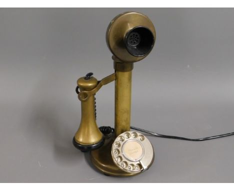 A British Telecom brass candlestick phone no.08150, 13in high