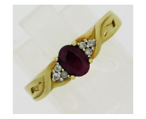 A 9ct gold ring set with six small diamonds &amp; ruby, size O/P, 2.1g