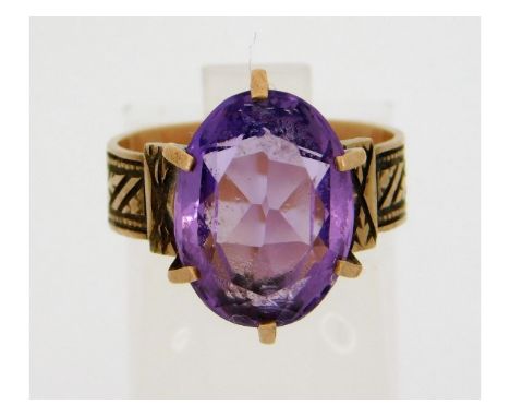 A yellow metal ring, tests electronically as 9ct gold, set with amethyst, size K/L, 4.2g 