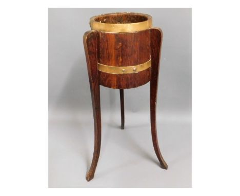 A brass bound oak planter, 31.75in tall