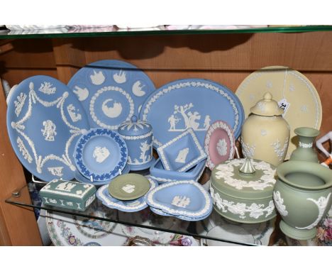 A COLLECTION OF WEDGWOOD JASPERWARE, nineteen in different colours, comprising a pink trinket dish, a yellow covered vase and