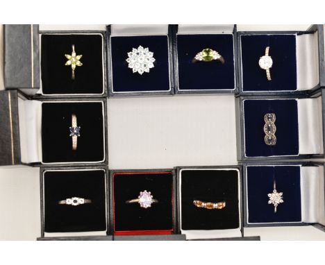 A SELECTION OF TEN WHITE METAL GEM SET RINGS, various designs, set with assorted cubic zirconia or semi-precious gemstones, m