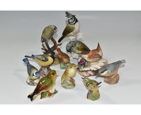 A GROUP OF EIGHT ROYAL WORCESTER BIRDS AND FOUR SIMILIAR PORCELAIN BIRDS, comprising Great Tit, Nuthatch, Blue Tit, Gold Cres