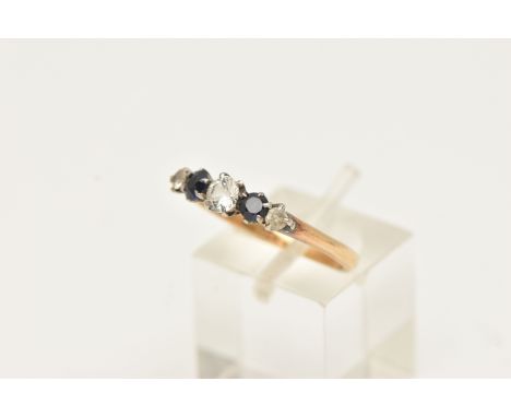 A GEM SET FIVE STONE RING, set with two graduating synthetic blue sapphires and colourless gemstones, claw set to the plain p