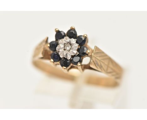 A 9CT GOLD DIAMOND AND SAPPHIRE CLUSTER RING, set with a central single cut diamond illusion set within a surround of small c
