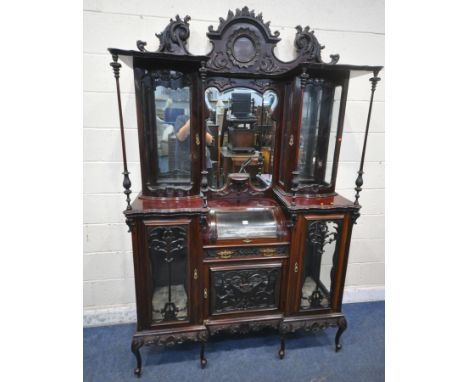 AN EARLY 20TH CENTURY MAHOGANY DISPLAY CABINET, the raised back with foliate and scrolled details, the shaped central bevelle