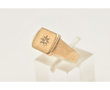 A GENTS 9CT GOLD DIAMOND SET SIGNET RING, square signet with a star set round brilliant cut diamond, to a polished band, hall