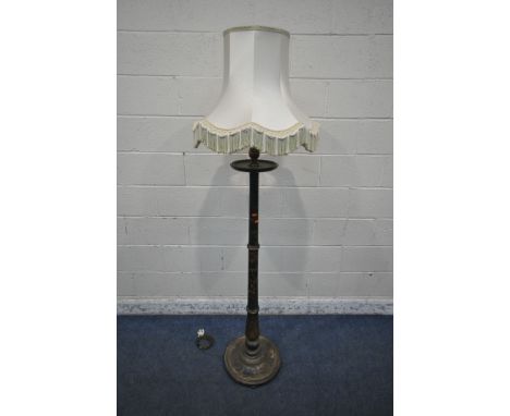 AN EBONISED AND CHINOISERIE STANDARD LAMP, with a small dished shelf, depicting bamboo, people, flowers, etc, height to fitti