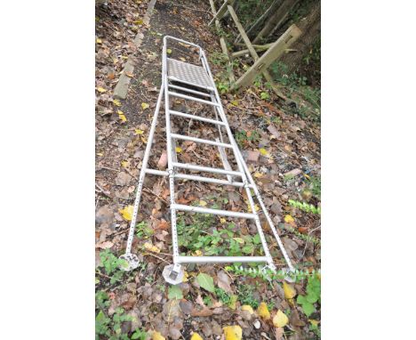 A SET OF ADJUSTABLE LEGGED ALUMINIUM STEP LADDERS, from ladder safety devices, 320cm high with a 60x50cm platform as top step