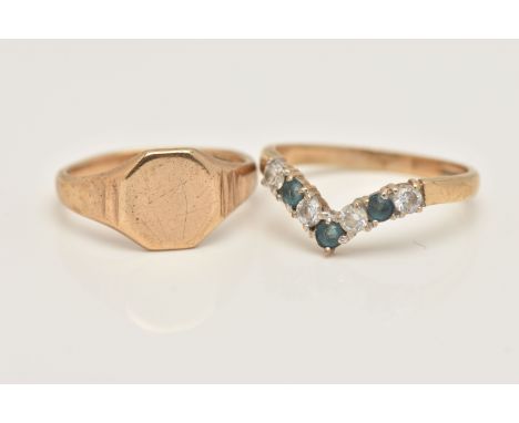 TWO 9CT GOLD RINGS, the first a polished signet ring, hallmarked 9ct Birmingham, ring size I 1/2, the second a wish bone ring