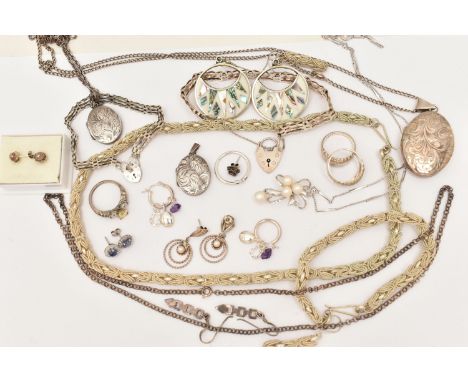AN ASSORTMENT OF WHITE METAL JEWELLERY, to include a large silver foliate pattern locket, hallmarked Birmingham, fitted with 